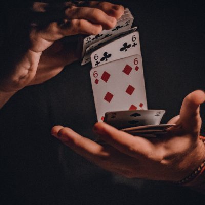 A Person Shuffling Cards
